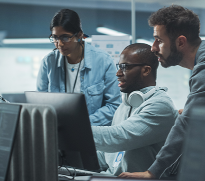 students working at computer in an IT setting