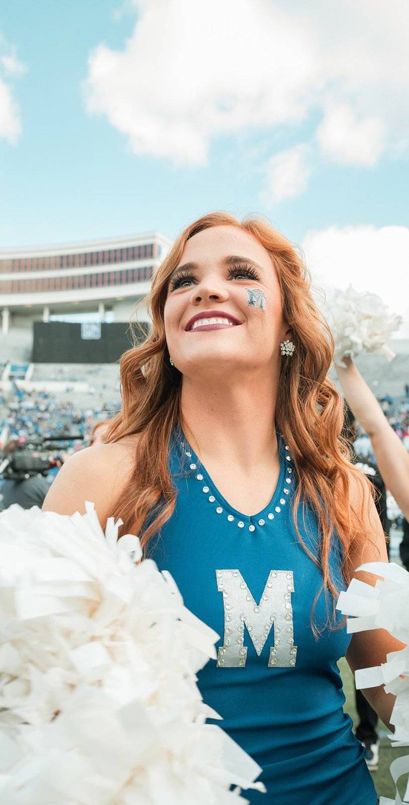 pom pom cheerleader at Memphis homecoming game
