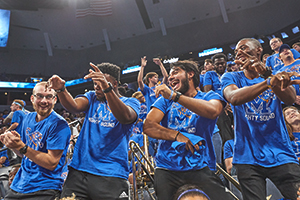 students dancing at basketball game