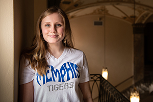 student wearing Memphis t-shirt