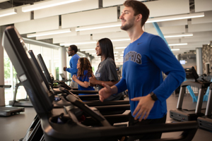 students on treadmills in Wellness Center