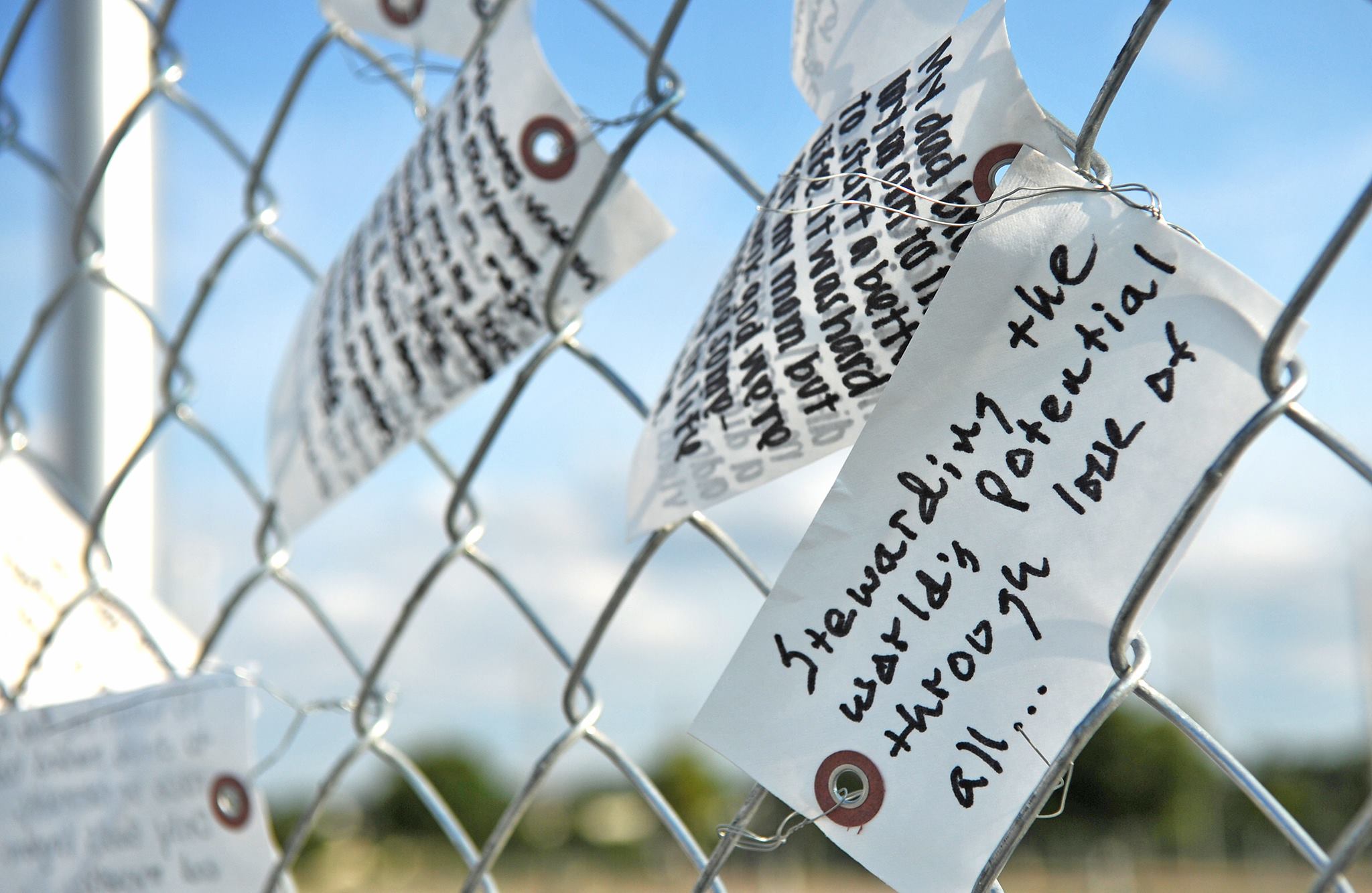 Barrier Free Project image features fence with hand written note attached