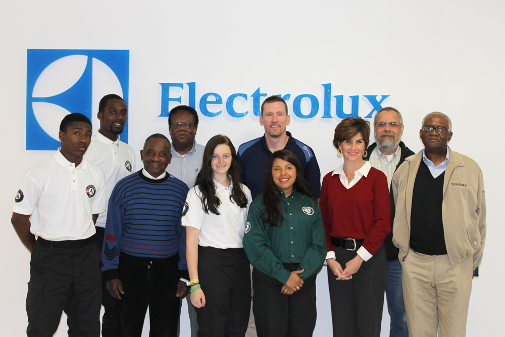 Dr. Robert Connolly (second from right) with Electrolux Team Members