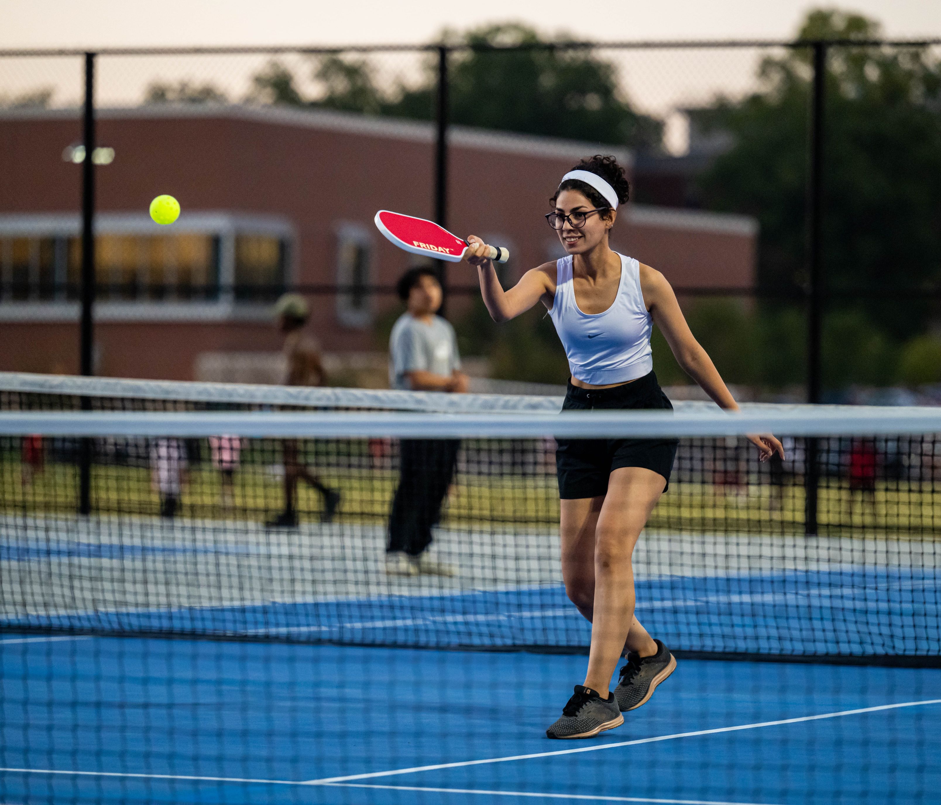 girl playing pickleball