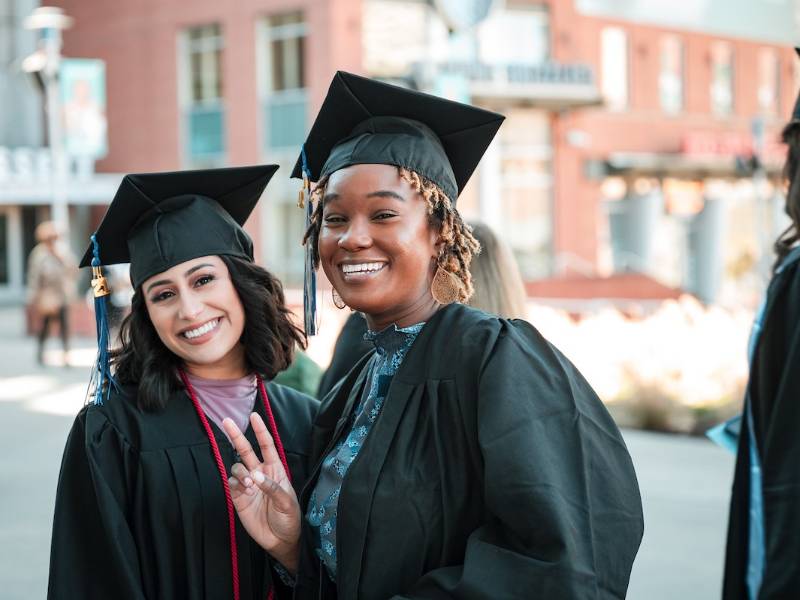 smiling students at commencement