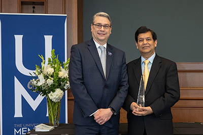 Dr. Mishra receiving award