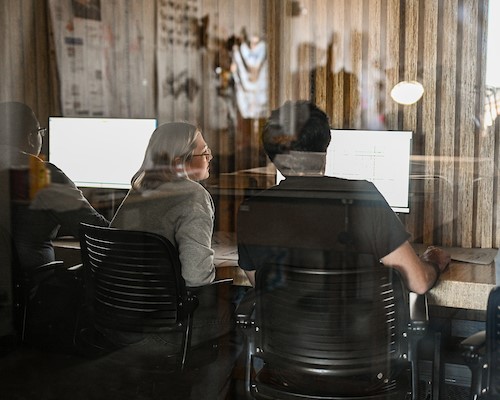 colleagues working at table