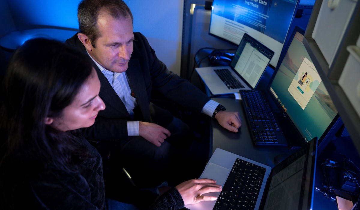 Dr. Vasile Rus working at computer