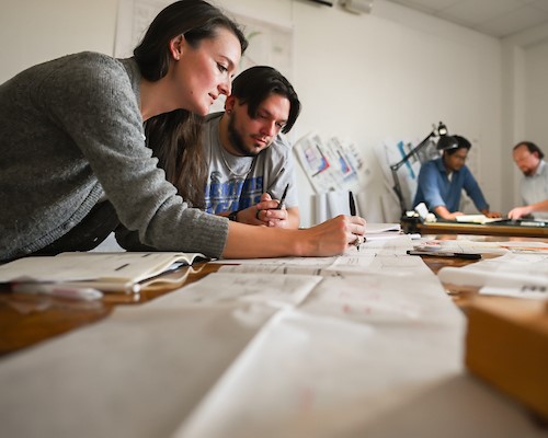 colleagues working in conference room