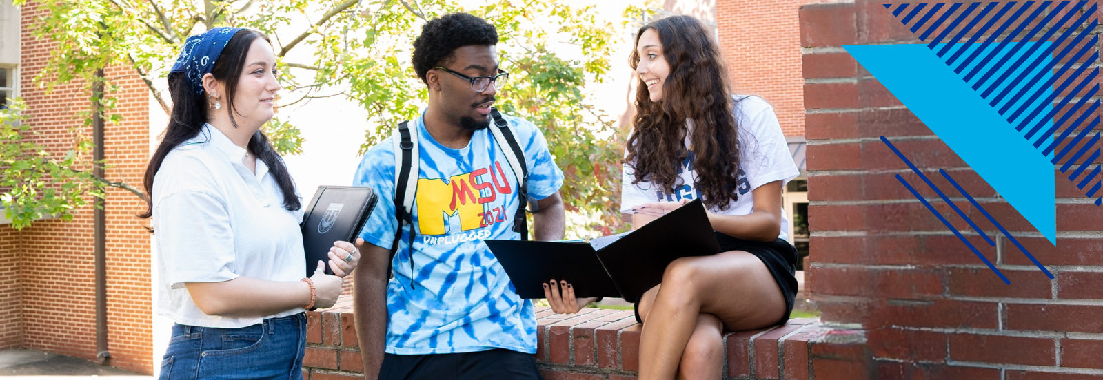 3 Students outside talkling