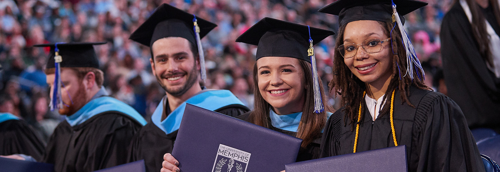 New UofM graduates proudly display their degrees