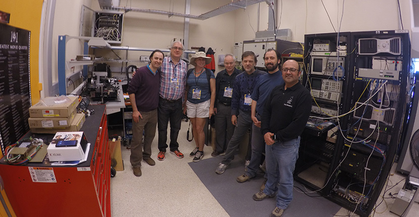 CLION Astroinformatics Project: Visit to ALMA Radiotelescope Array at Atacama Desert, Chile by Dr Robert Kozma (3rd from right) and Dr Paul Werbos, CLION Co-Director (4th from left), with Chilean astrophysicists, engineers, and visitors in the electronics lab of the telescope site.