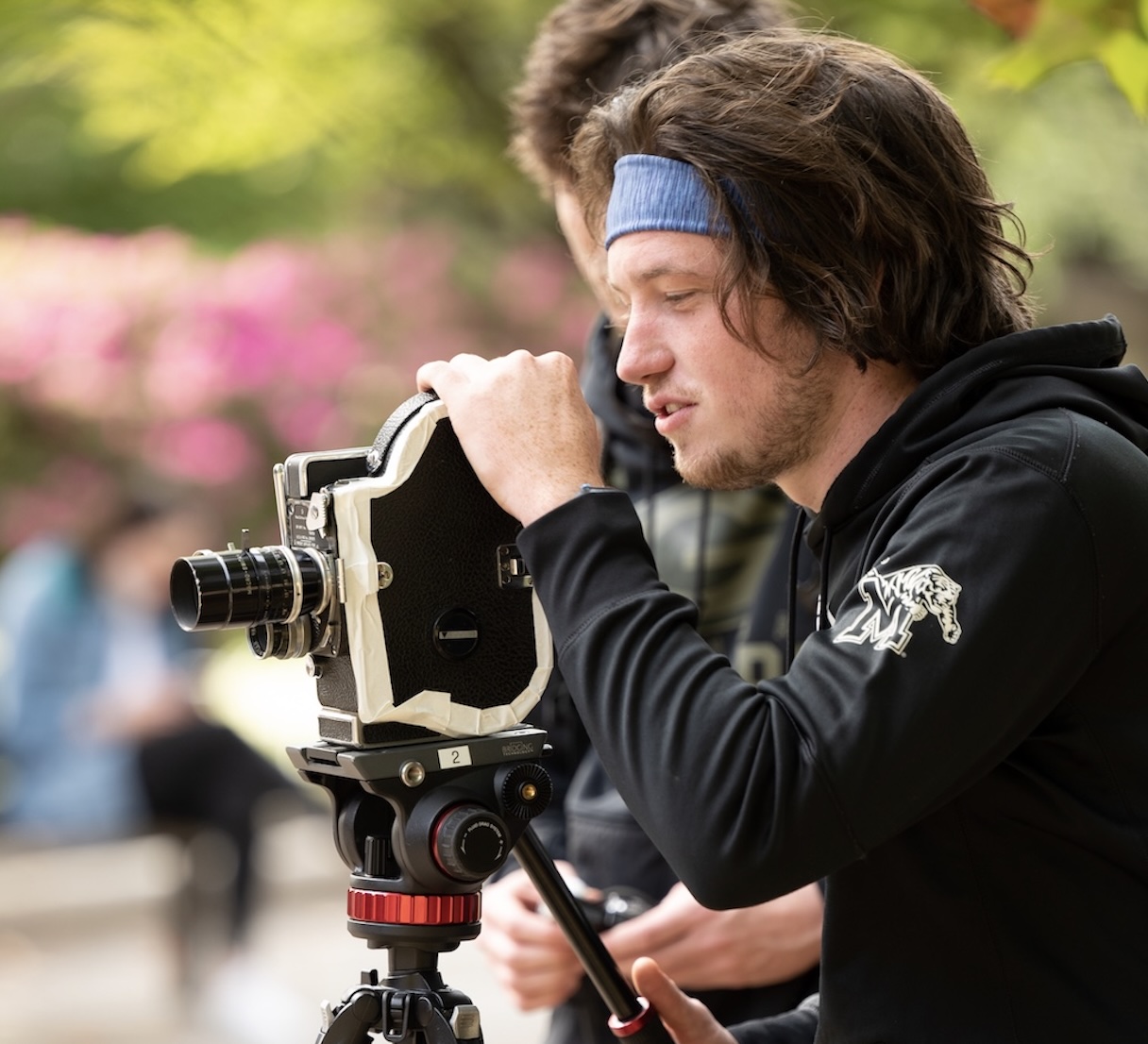 Man is filming using a video camera