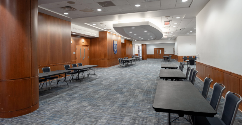 UC Ballroom Lobby B set with rectangular tables and chairs for a trade show