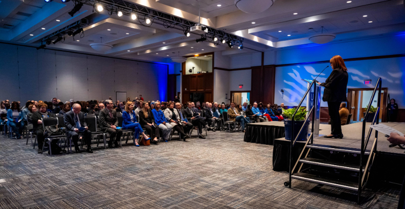 Photo of UC Ballroom with stage and chairs