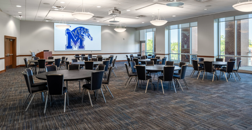 Bluff Room with round tables and screen