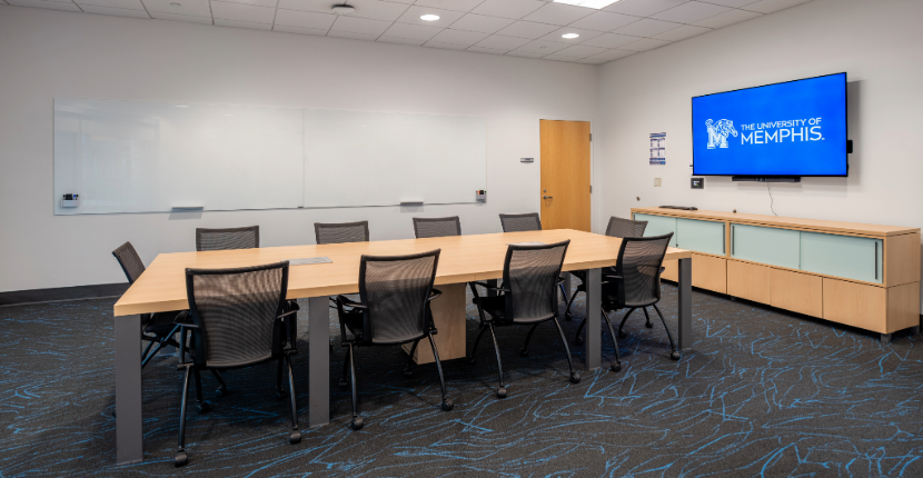 View of Conference Room 203 showing the table and whiteboard