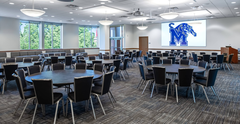 River Room with round tables and screen