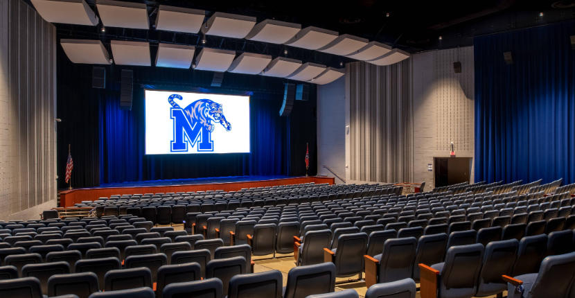 Rose Theatre with rows of chairs, stage and projection screen