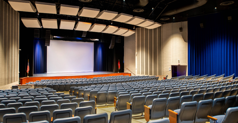 Rose Theatre with rows of chairs, stage and cyclorama
