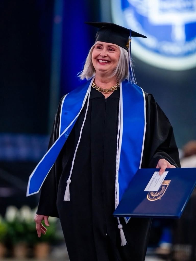 Photo of Teresa G. at her graduation.