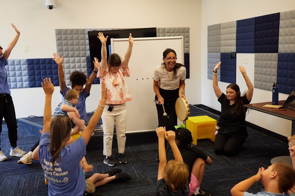 Darlene Winters, SLP clinical instructor, works with a group of students and clients. She is the School's lead on the re-norming project.