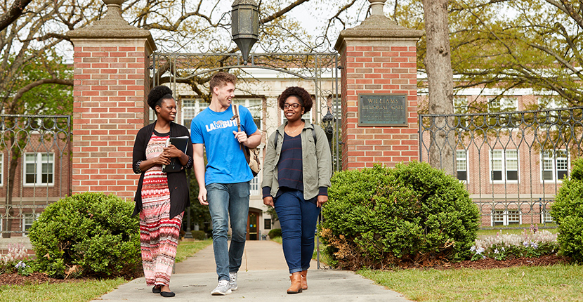 students walking out of gates