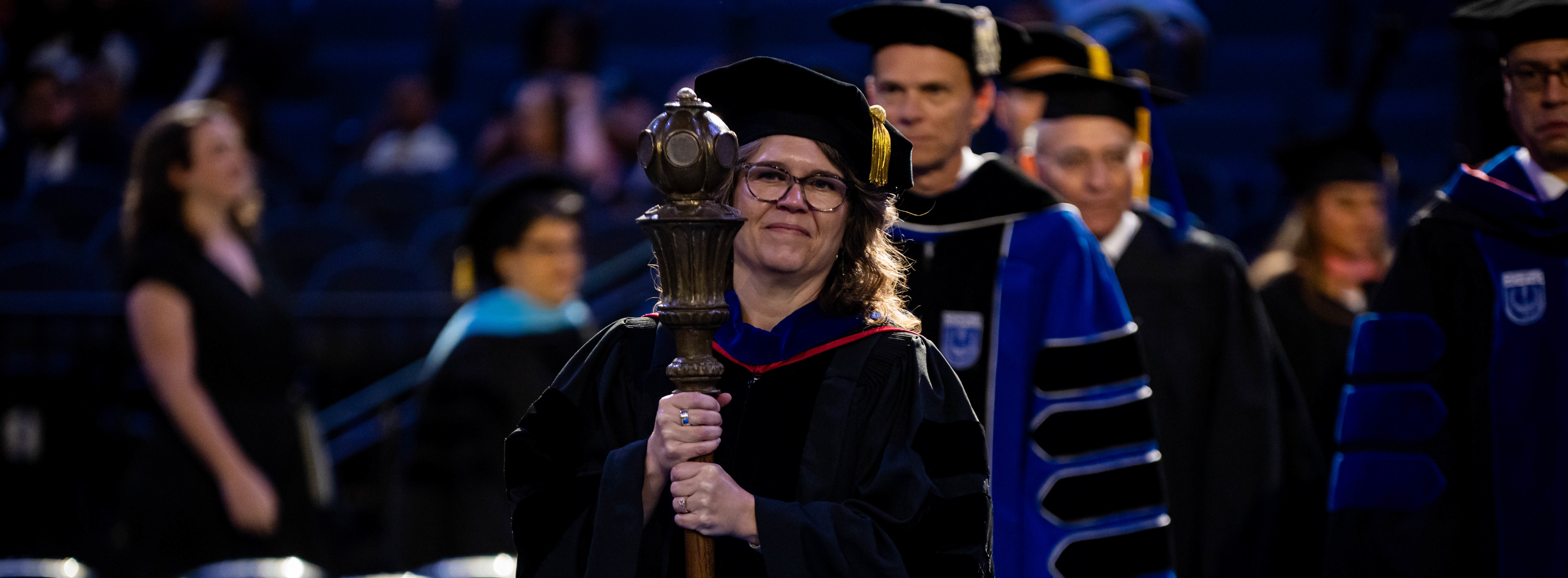 Faculty Senate President with Mace at Commencement