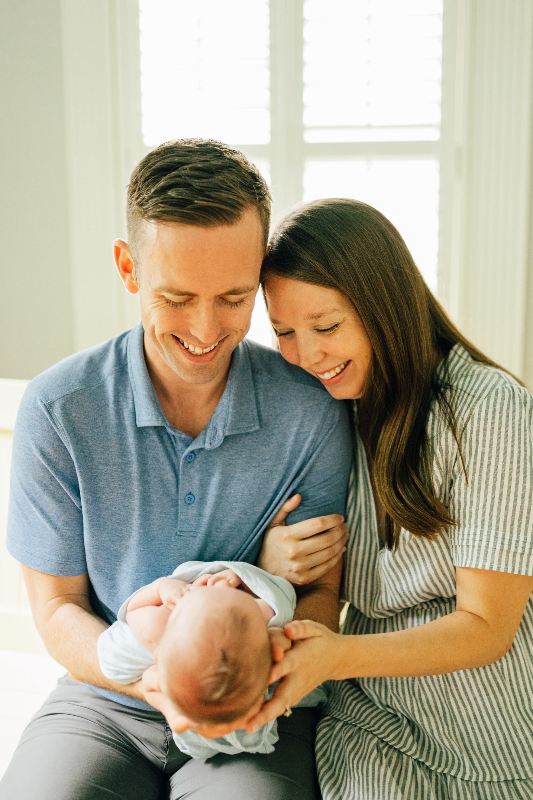 Dr. Alex Pratt with wife and newborn son