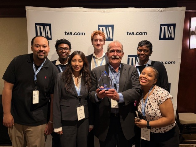 Prof. Napoleon Overton with FCBE students Samuel McDowell, Ximena Olguin, Thelonious Hassinger, Samaya Owsley, Antonio Jackson and Jade Davis
