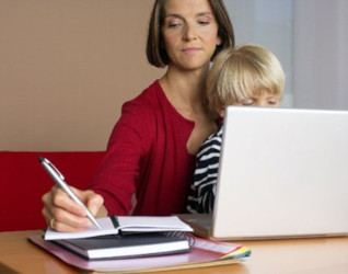person with children on laptop
