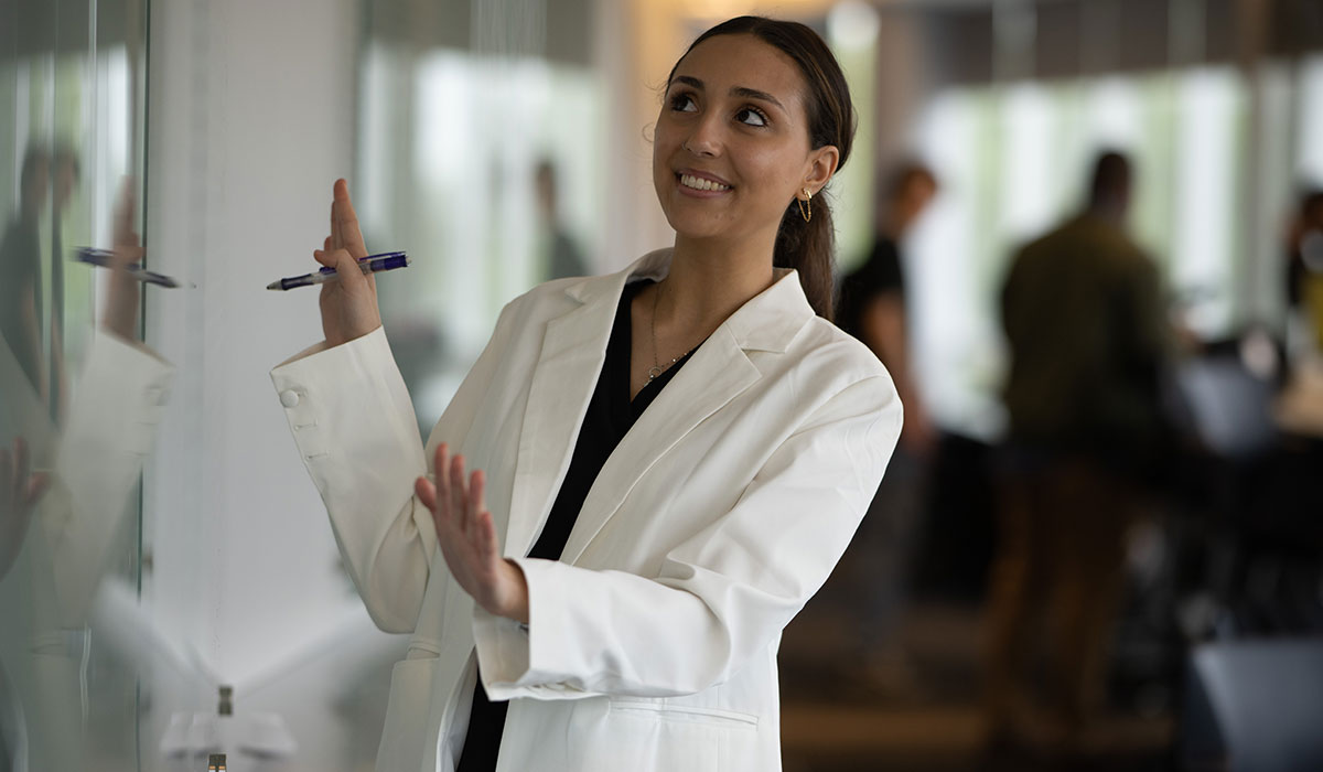 Woman looking at whiteboard