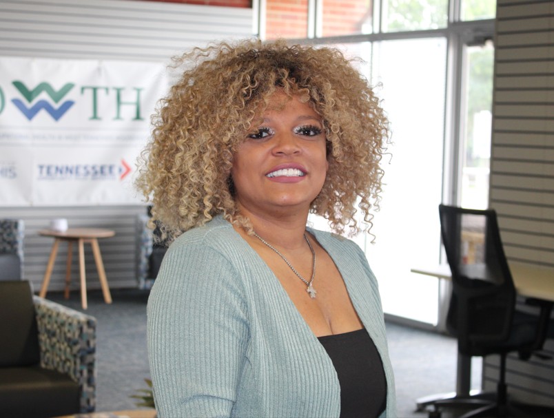 Photo of participant Danielle, posing portrait style in the foyer of the GROWWTH offices.