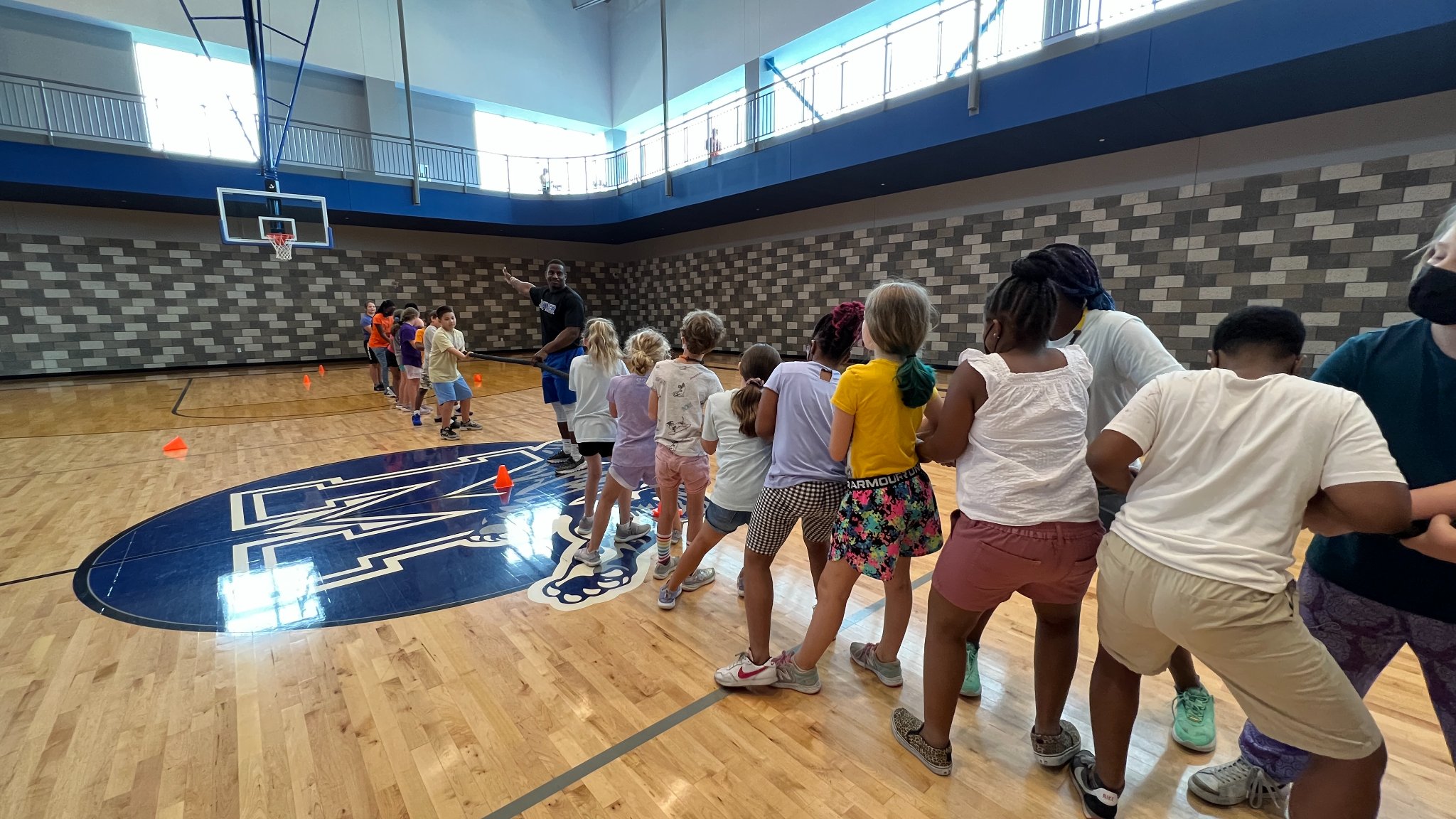 Camp CHEF campers playing tug-o-war in gym