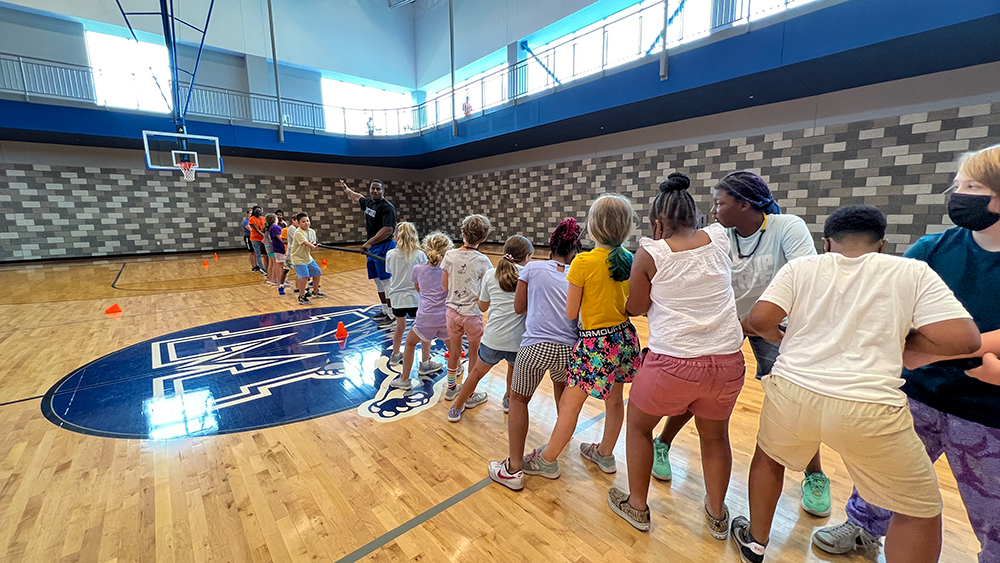 Kids playing tug of war in gym