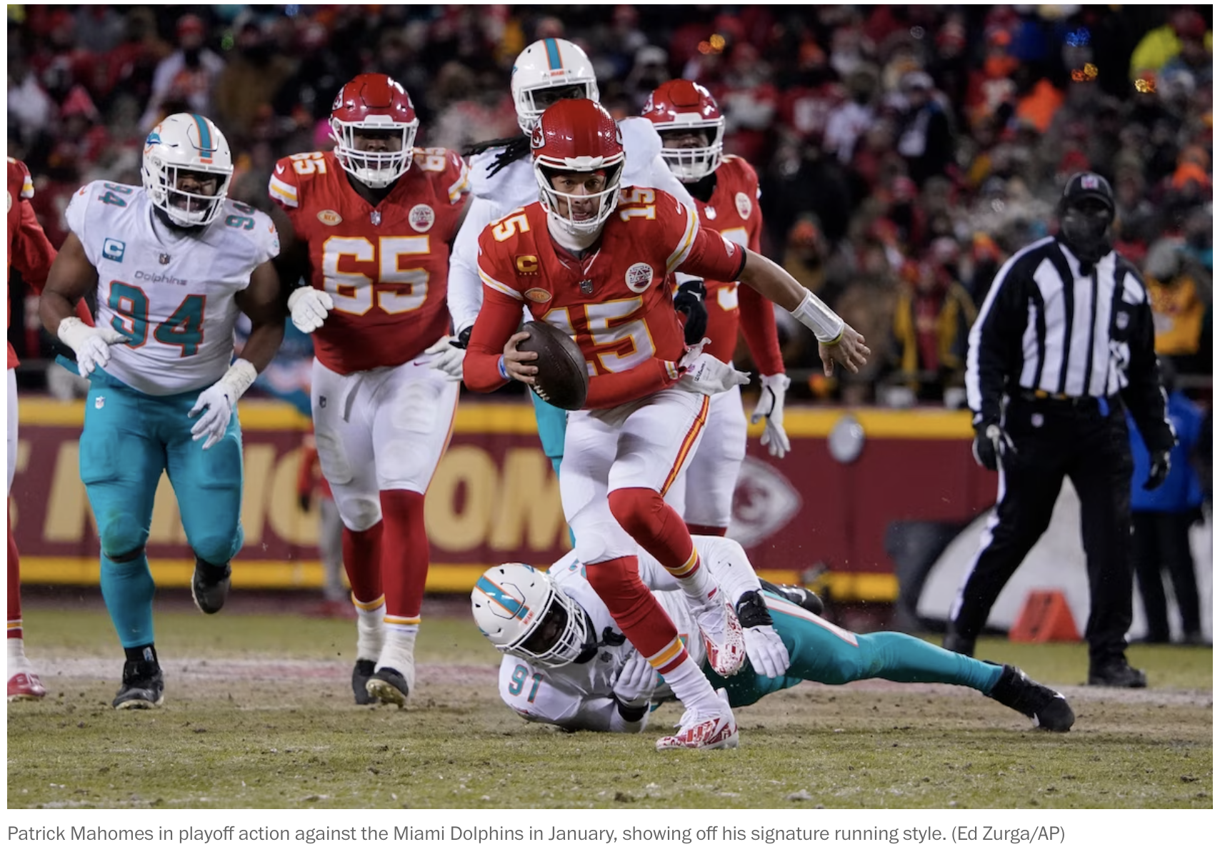 Patrick Mahomes in playoff action against the Miami Dolphins in January, showing off his signature running style. (Ed Zurga/AP)