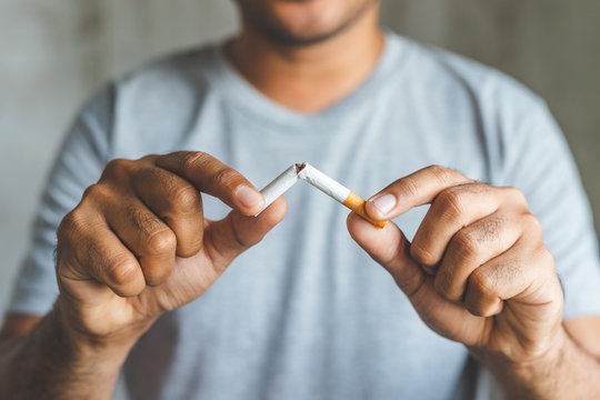 Recommended size: 800 × 600 px A person breaking a cigarette