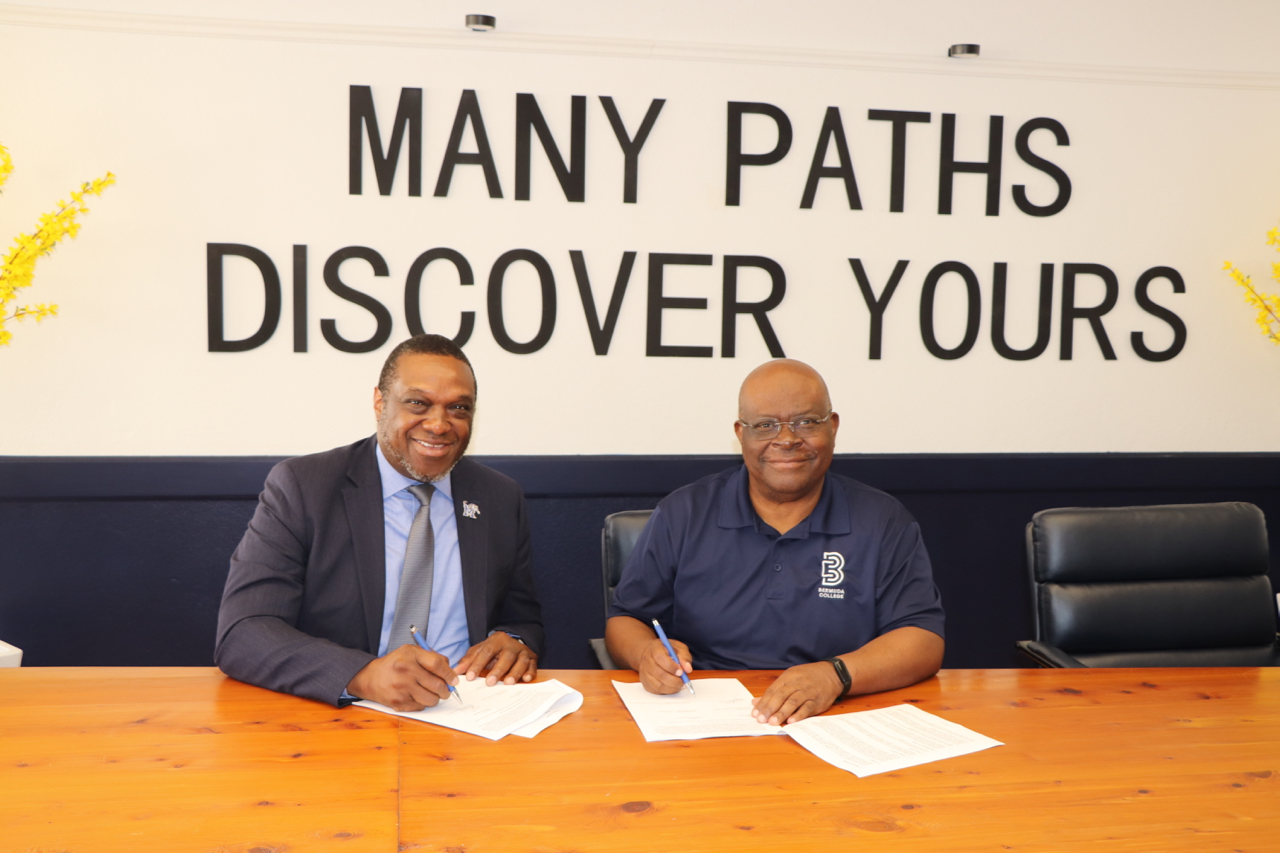  (Herff College of Engineering Dean Okoli, second from left, signs an agreement with representatives of Bermuda College.) 