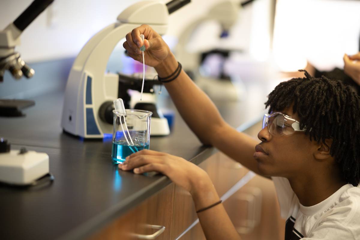 Student performing an experiment