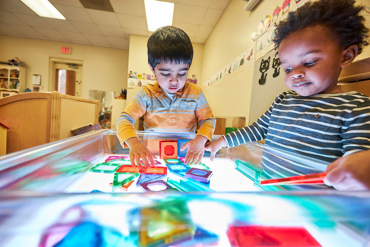 Children playing with a table