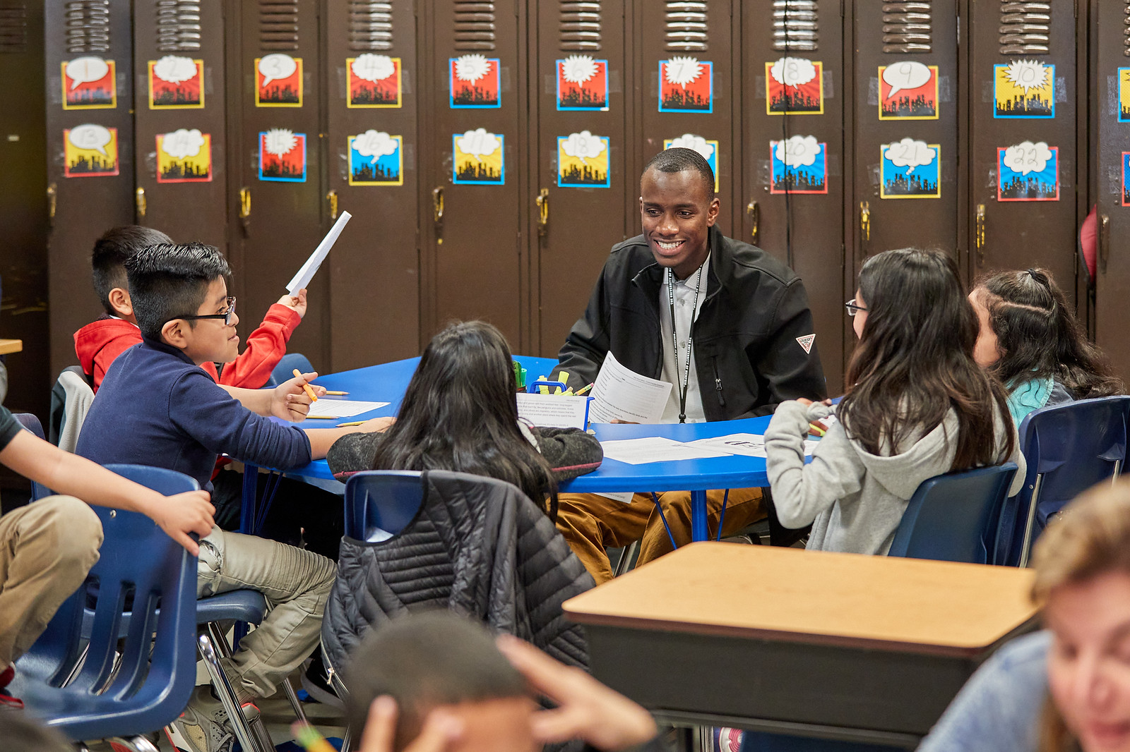 Male teacher working with students