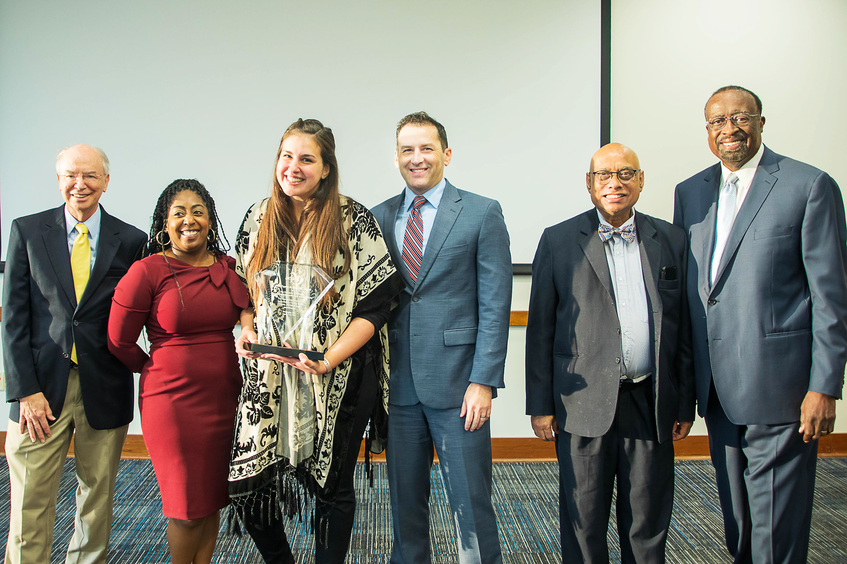 David Arant joins the JRSM Department’s Diversity Committee in accepting its award on Sept. 20. From left to right are Arant, Chalise Macklin, Taylor Ackerman, Ryan Fisher, Deb Aikat and Otis Sanford.  PHOTO/Casey Hilder