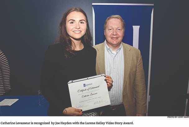 Dr. Hayden presents Catherine Levasseur with Video Story Award