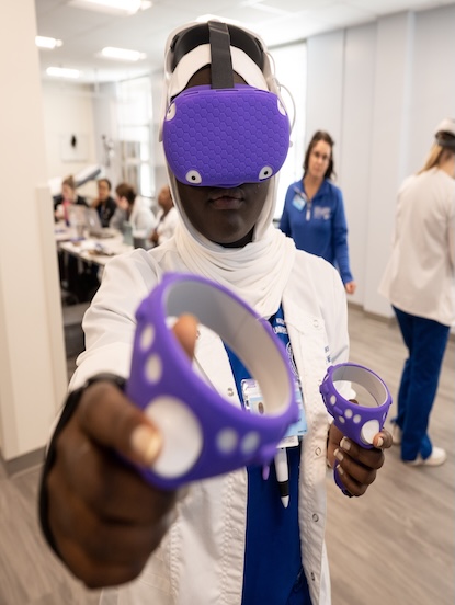 nursing student using the virtual simulator