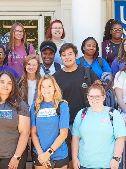 new students standing on steps