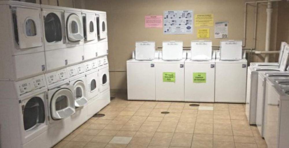 Rawls Hall Laundry Room equipped with eight washers and ten dryers machines and facilities