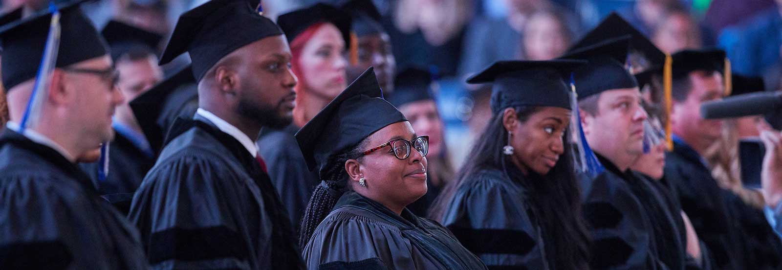 students in commencement robes