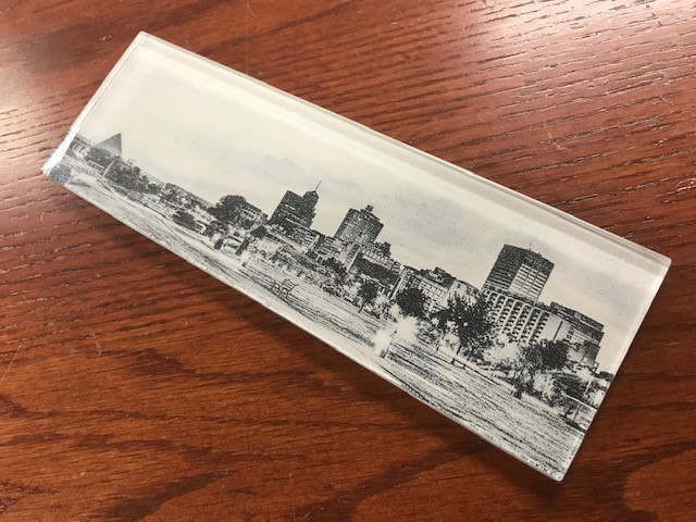 A black and white etching of downtown Memphis on a glass tile