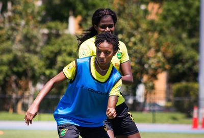 Chanel playing soccer for Jamaica