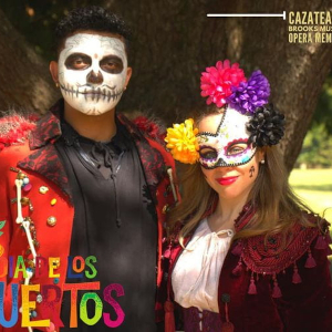 Two people celebrating Dia De Los Muertos